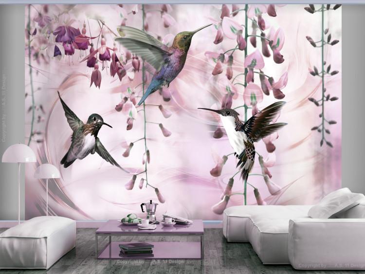 Wall Mural Flying birds - motif of hummingbirds among flowers in pink shades