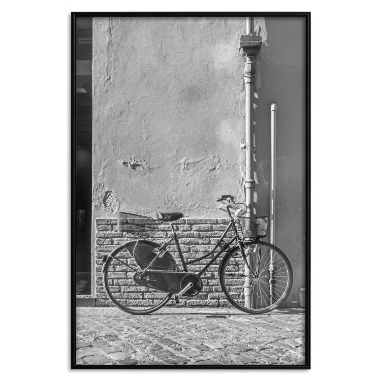 Poster Old Italian Bicycle - black and white shot with a view of a stone street