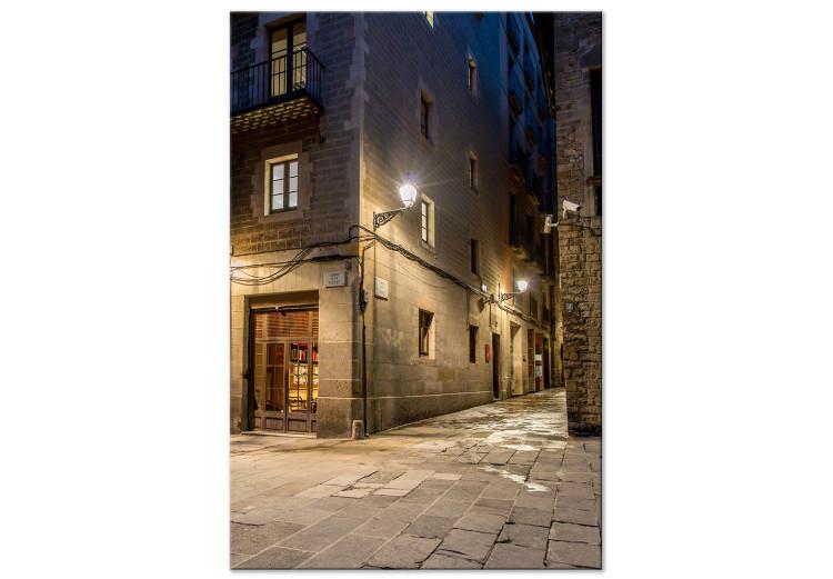 Canvas Narrow streets - a city with narrow stone streets in the night scenery at the light of the lantern