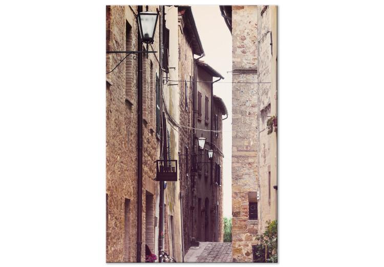 Canvas Narrow street and tenement houses - street photo of houses and lantern