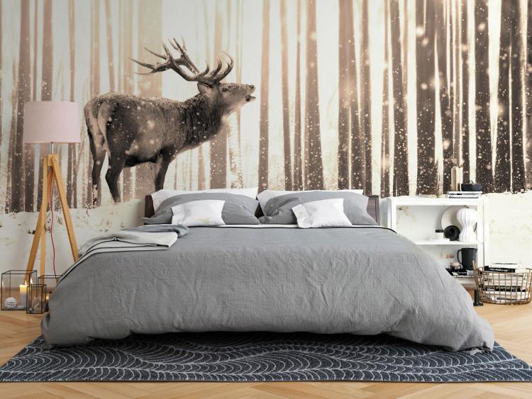 Wall Mural Deer in the forest - winter forest landscape with deer on a background of trees in sepia