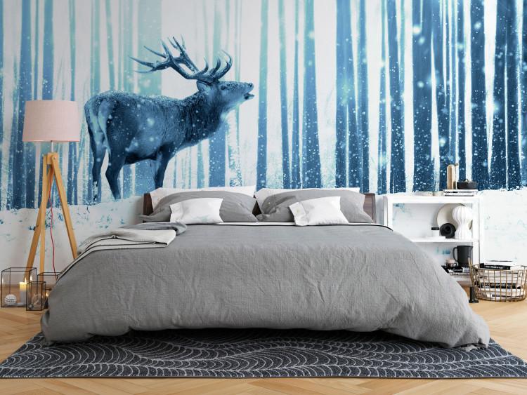 Wall Mural Winter animals - deer motif on a forest background in shades of blue