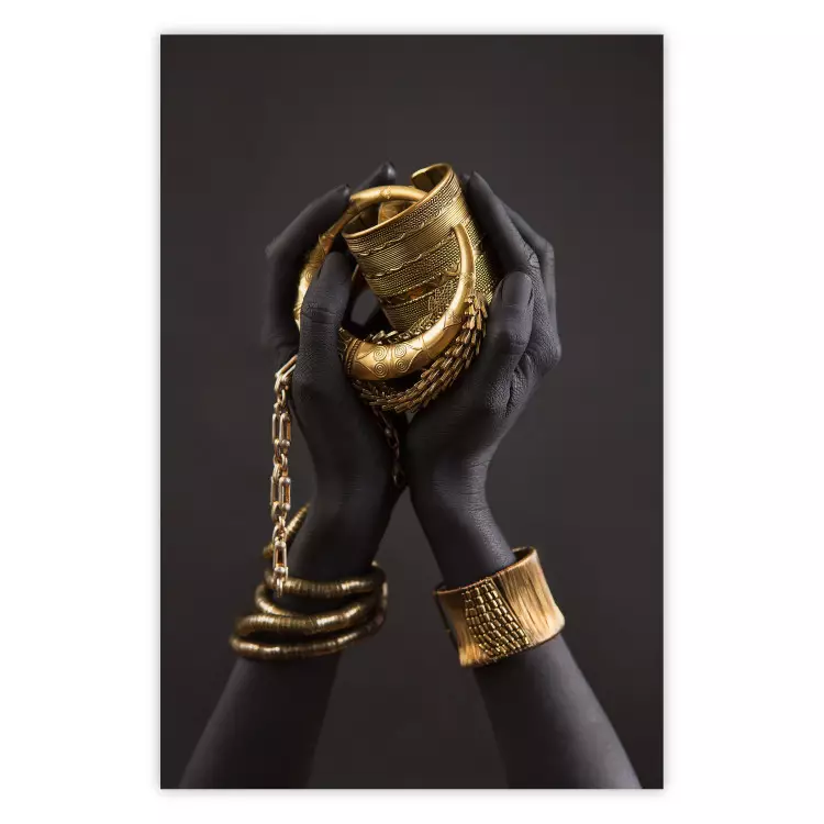 Poster Gold of the Desert - black hands with golden items on a dark background