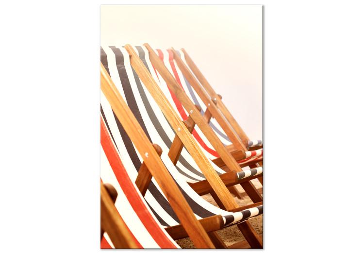 Canvas Wooden beach sun loungers - photo on a beige background