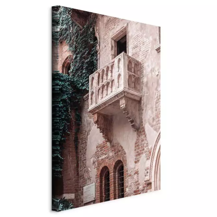 Balcony of a brick tenement - photo with an Italian city architecture