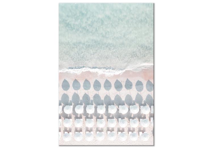 Canvas White umbrellas and sun loungers on the beach - pastel aerial view