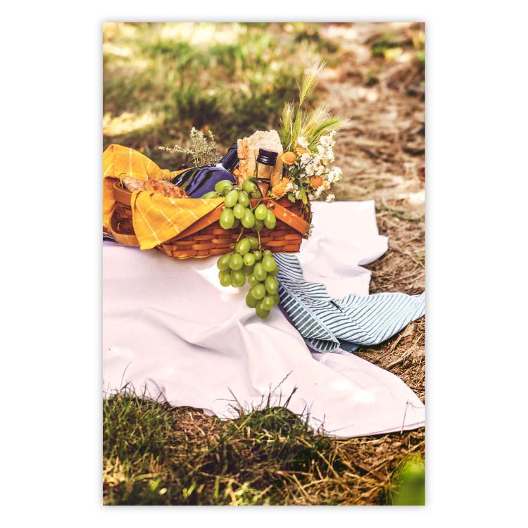Poster Picnic - composition with green fruits in a wicker basket against a natural background