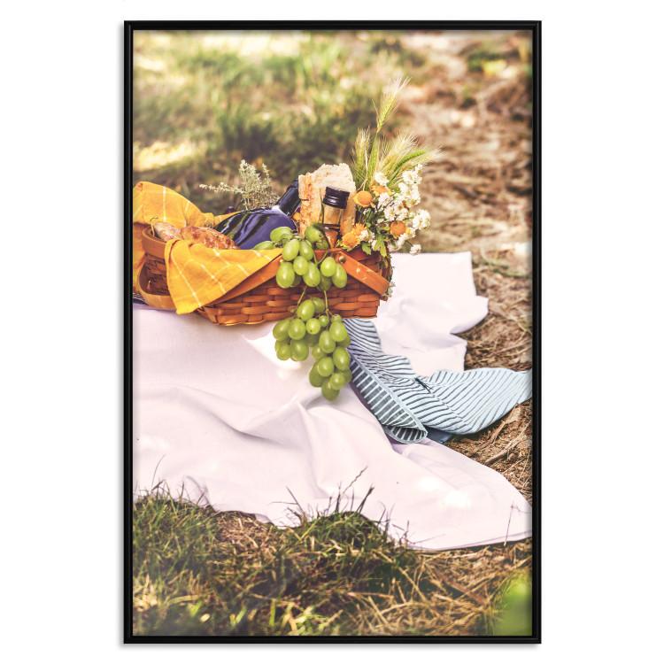 Poster Picnic - composition with green fruits in a wicker basket against a natural background