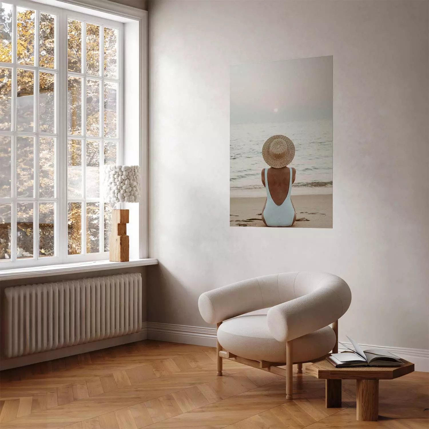 Wall Poster Beach Rest - woman sitting on the sand with sunset in the background