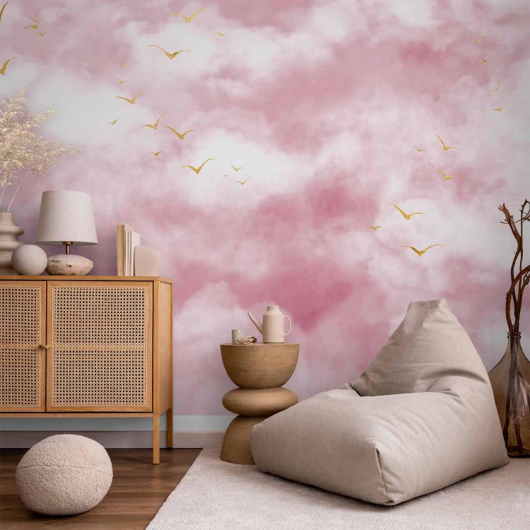Wall Mural Pastel sky - Clouds on the sky in shades of powder pink with minimalist golden birds