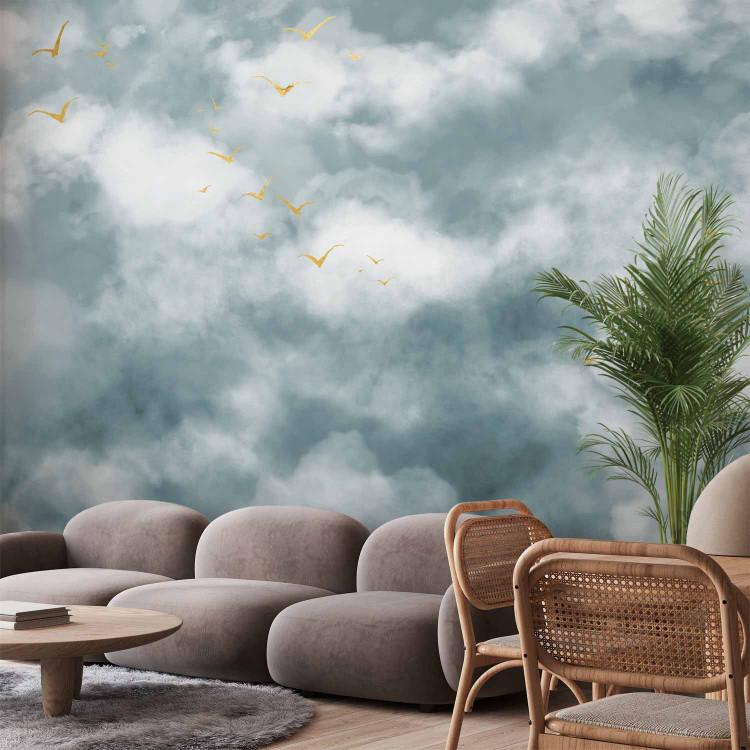 Wall Mural Flight of Freedom - Clouds in the sky in pastel shades and abstract golden birds