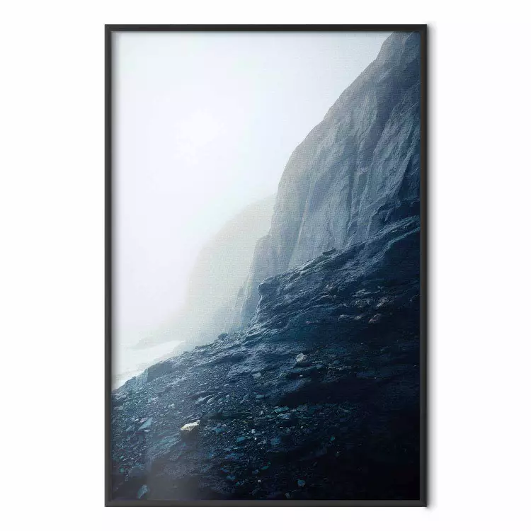 Misty Statue - landscape of rocky cliffs above water in thick fog