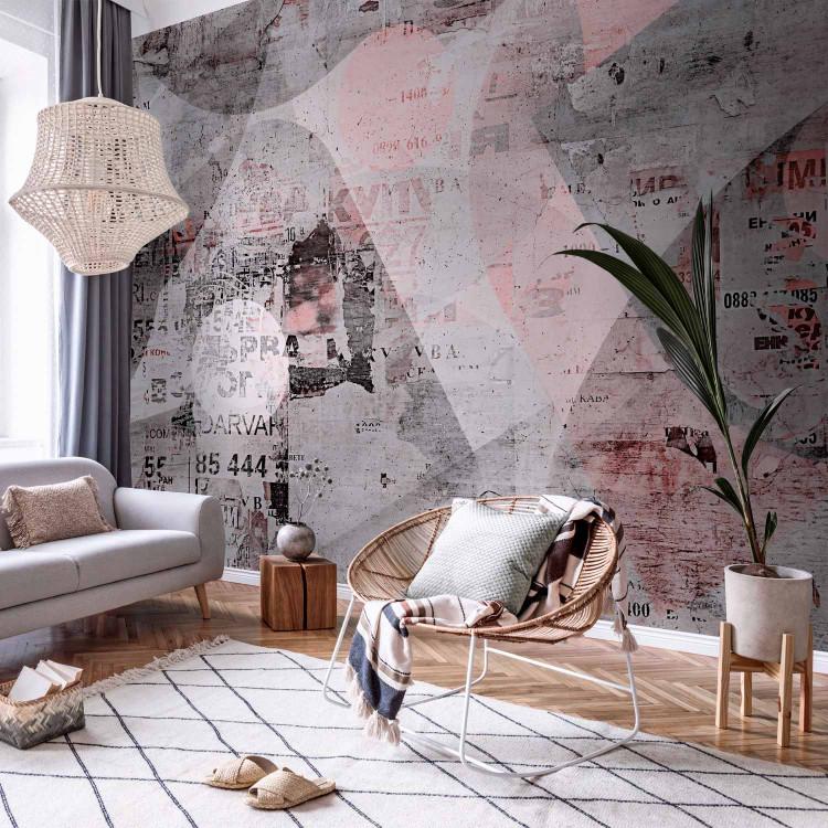 Wall Mural Pink abstraction - motif with inscriptions on a grey background with concrete texture