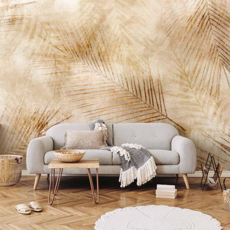 Wall Mural Desert - landscape with a delicate palm leaf motif on a beige background
