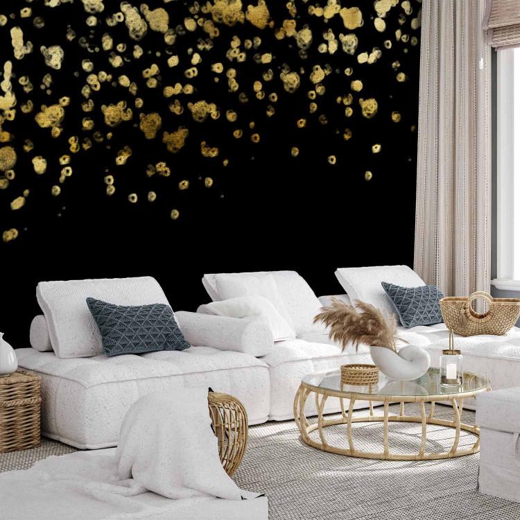 Wall Mural Golden drops - abstract with golden rain effect on black background