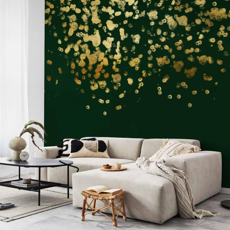 Wall Mural Golden drops - abstract with golden rain effect on green background