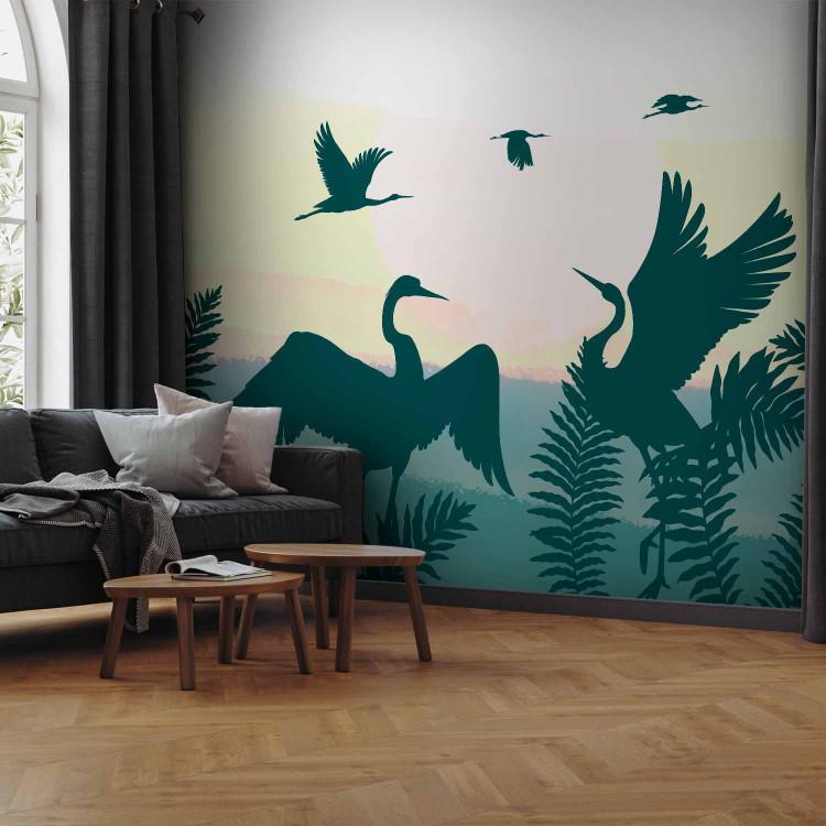 Wall Mural Animals in the fern - green birds on a yellow sunset background