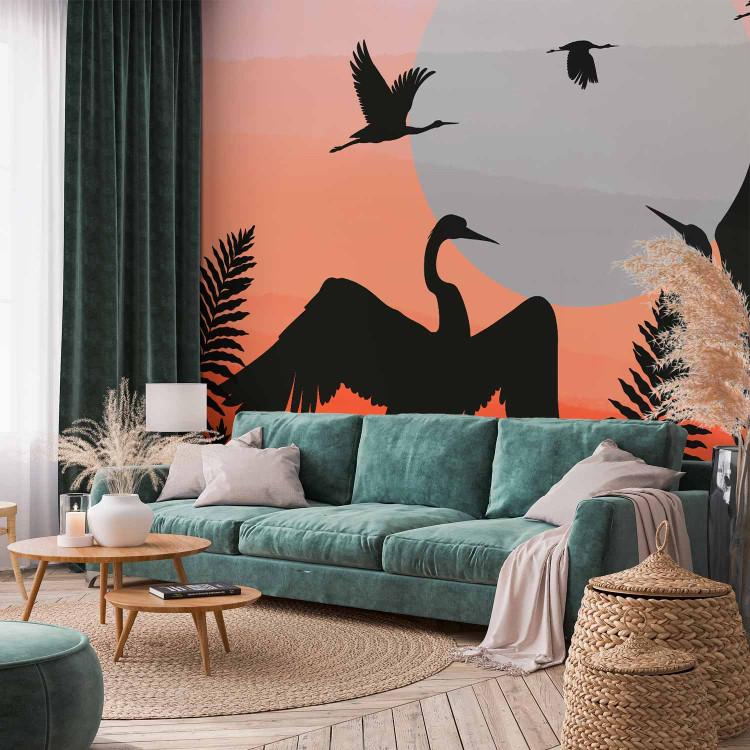 Wall Mural Animals in the fern - birds on an orange sunset background
