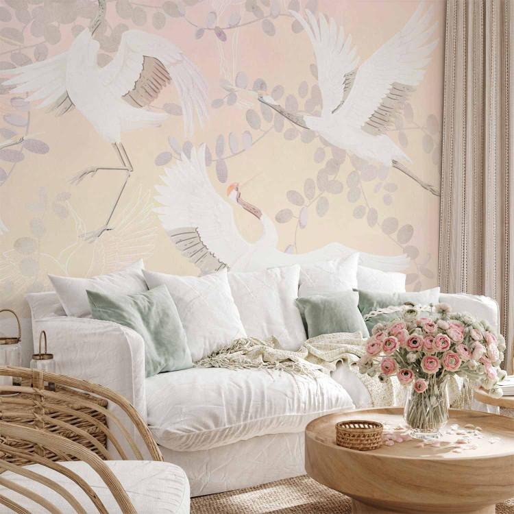 Wall Mural Dancing animals - birds among leaves motif on a background in shades of pink