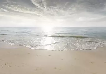 Wall Mural Sand and sun - landscape with calm sea and beach with footprints Wallpaper Cropper