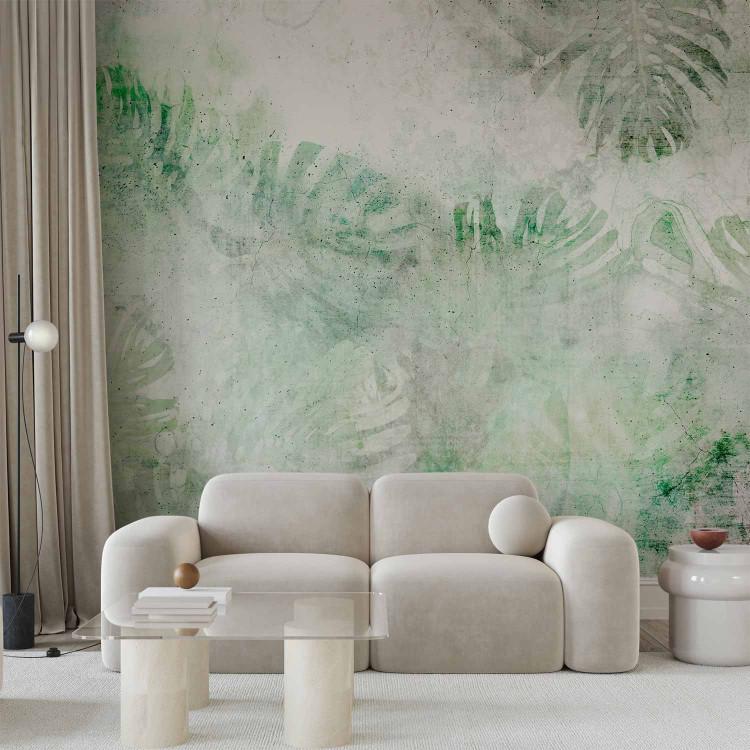 Wall Mural Monstera - landscape with green leaves on white background with concrete texture