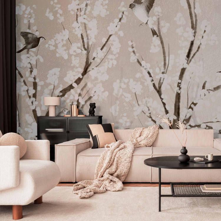 Wall Mural Trees with white flowers - birdscape on branches on beige background