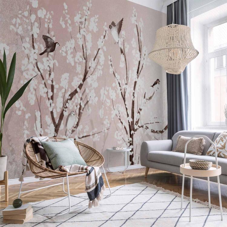 Wall Mural Trees with white flowers - birds in branches in spring on pink background