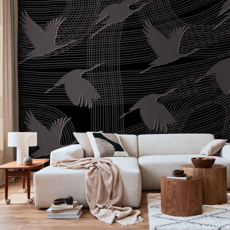 Wall Mural Flying cranes - birds flying on striped dark abstract background