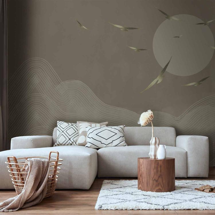 Wall Mural Golden birds flying towards the sun - abstract landscape with mountains