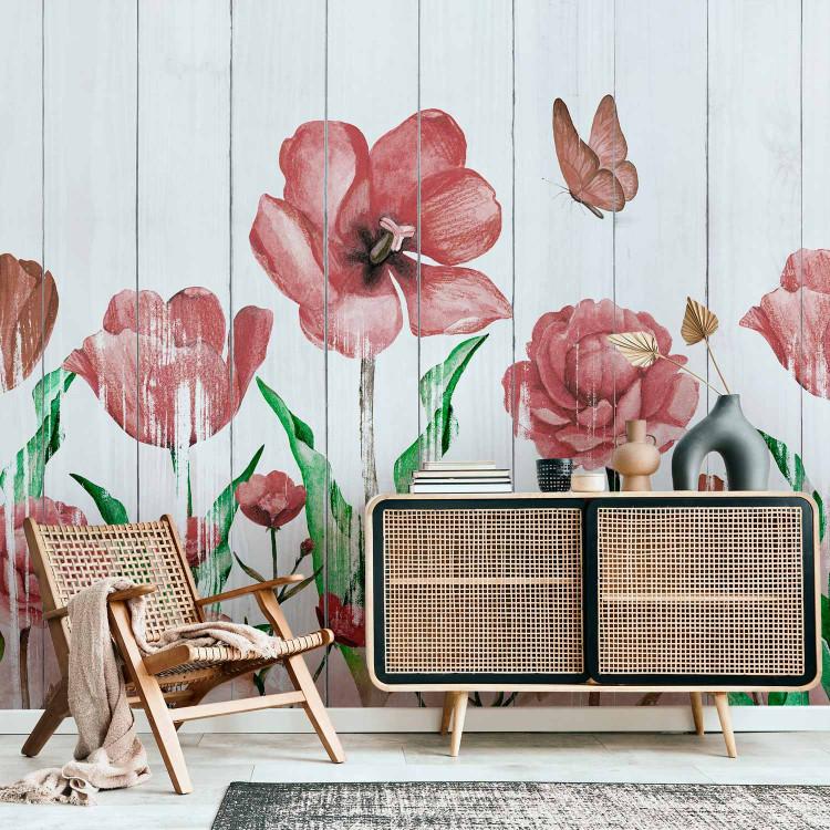 Wall Mural Tulips in a meadow - red flowers on a background of white wooden boards