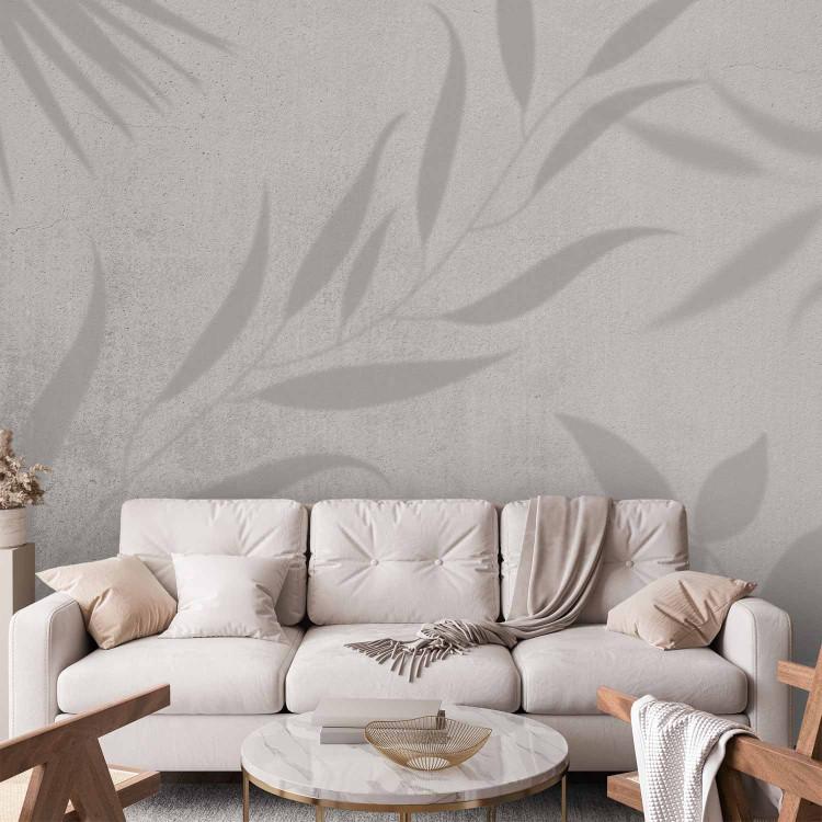 Wall Mural Leafy Illusion - Shadow of Plant Leaves on a Concrete White Background