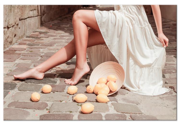 Canvas Lemons in the Sun (1-piece) - woman's legs and fruits lying on the street