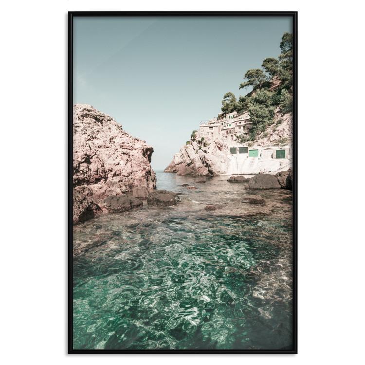 Poster Rocks in the Balearic Islands - Seascape With Houses in the Background