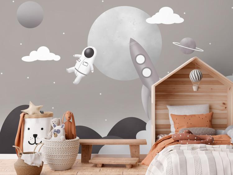 Wall Mural Astronaut in Space - Rocket and Planets in the Gray-Brown Sky