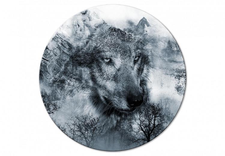 Round Canvas Print Predator From the Mountains - Wolf Against the Background of a Winter Forest and Snowy Peaks