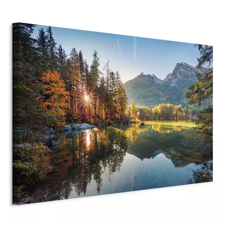 Rays of autumn - the sun breaking through the forest and mountains