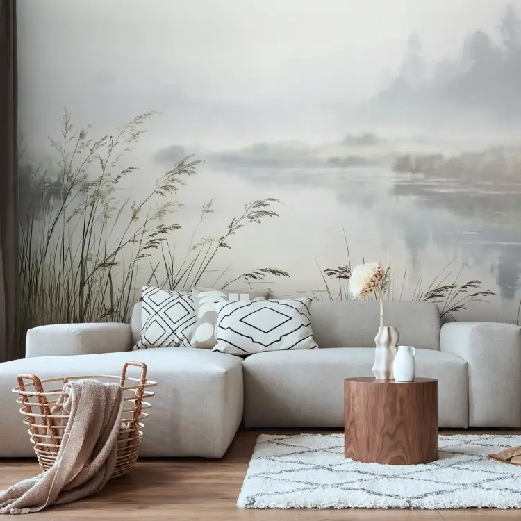 A quiet river - delicate blades of grass over the water in a bright, misty setting