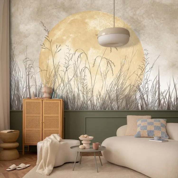 Golden moon - grasses in the wind against the background of a large night globe