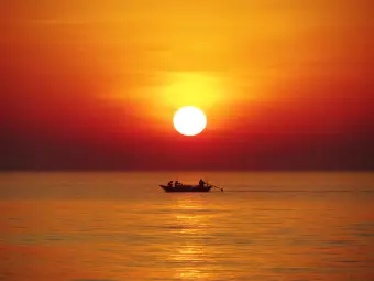 Photo Wallpaper Sunset with fishing boat Wallpaper Cropper