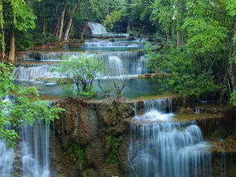 Photo Wallpaper Nature of Thailand - Landscape of Waterfalls Flowing into Water in the Forest Wallpaper Cropper