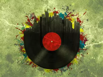 Wall Mural Sounds of the City - Vinyl record on a green background with various colors Wallpaper Cropper