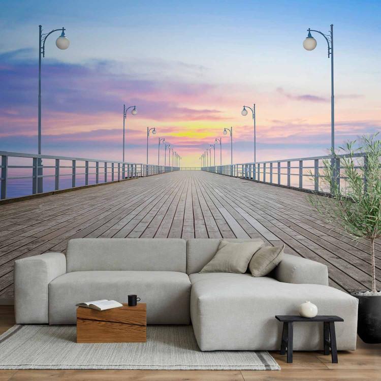 Wall Mural Sunset on the Pier - Landscape with a Tranquil Sea and a White Bridge