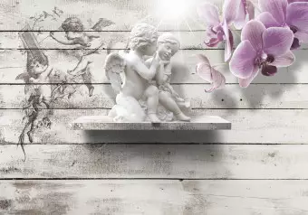 Wall Mural Cupid's Kiss - statue of angelic couple on a backdrop of gray wood with an orchid Wallpaper Cropper