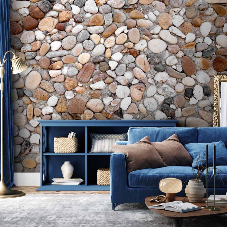 Wall Mural Rocky Beach - Design with Uniform Motif of Various Stones on Sand