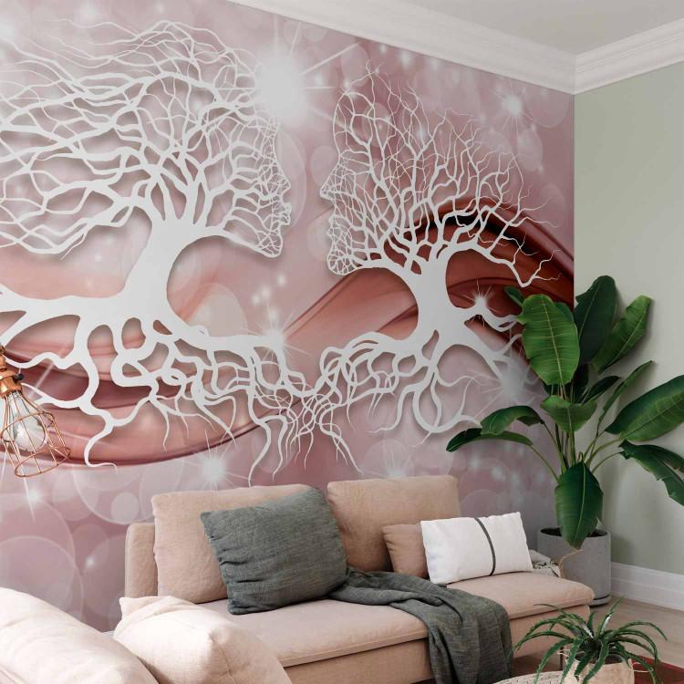 Wall Mural Tree kiss - tree branches in the form of a kiss on a rose background