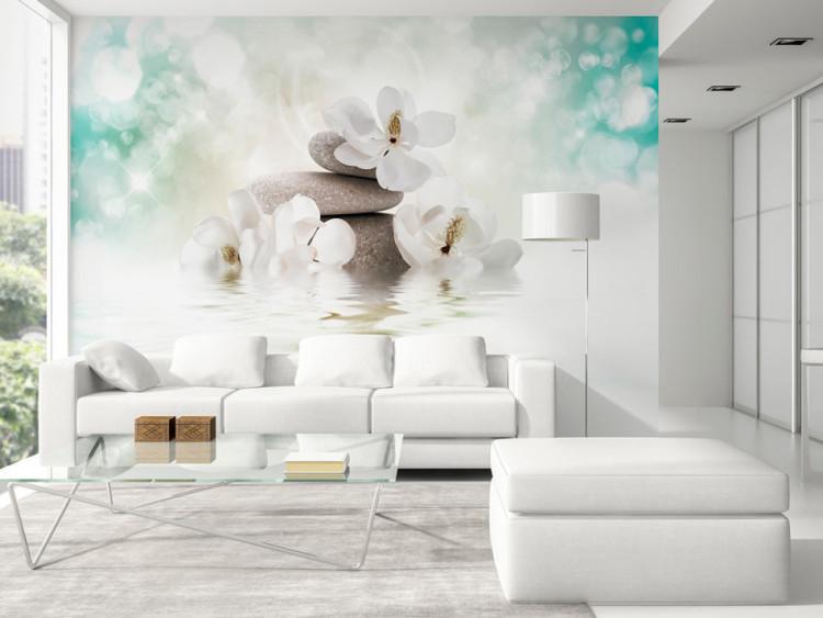 Wall Mural Orient - magnolia flower motif with zen stones on a blue background