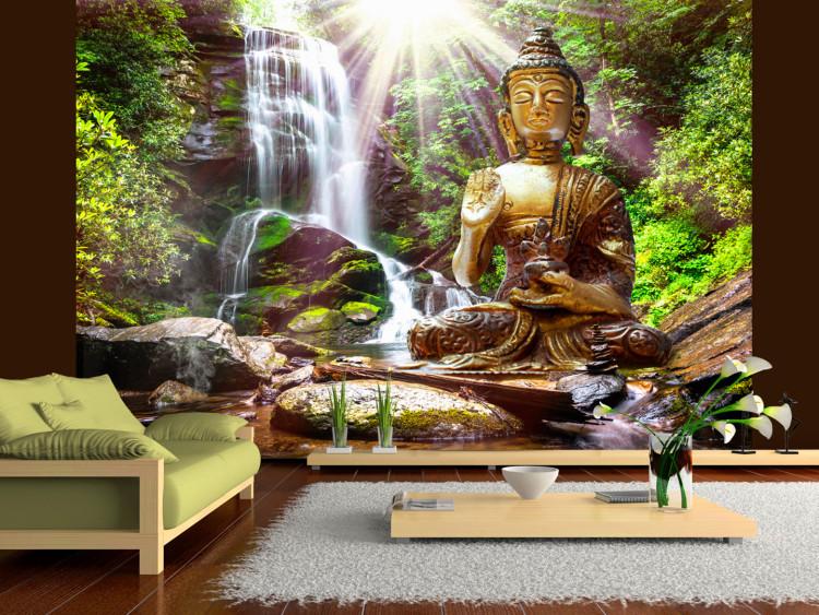 Wall Mural Forest prayer - Buddha sculpture on a background of a waterfall in a sunny jungle