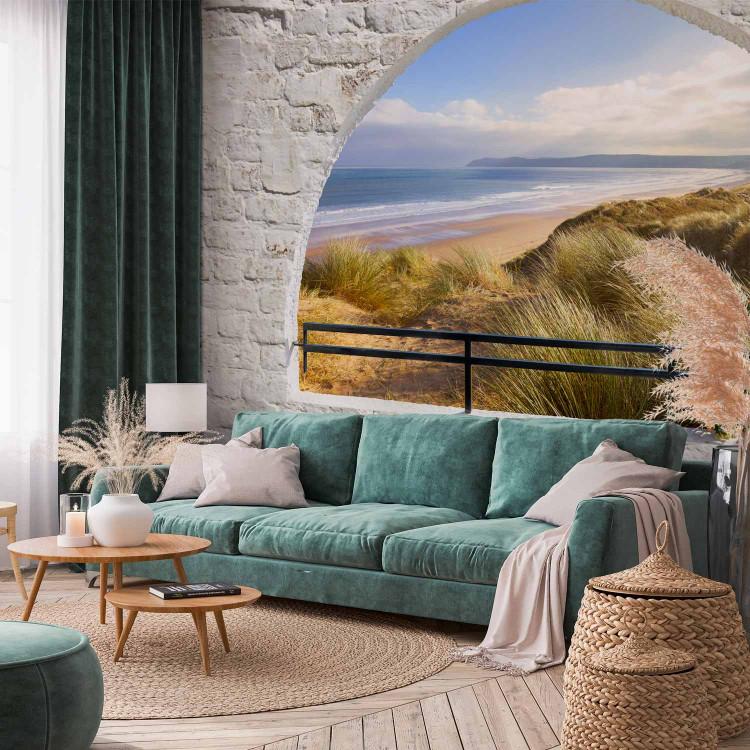 Wall Mural View from the window - landscape with sea and sandy beach surrounded by brick