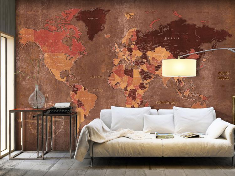 Wall Mural World in brown - map of the continents on a non-uniform background with a compass