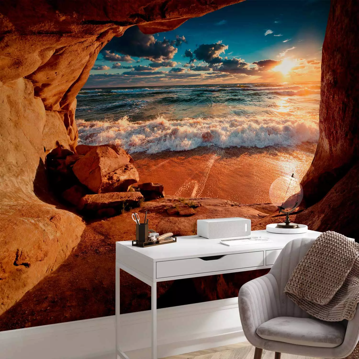 Wall Mural Cave by the beach - landscape with a restless sea at sunset